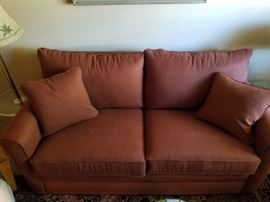 Laz-e Boy love seat-hidabed  in burnt orange!