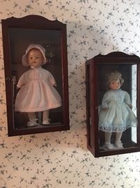 These dolls are almost a century old. Colonial House crafted these custom display cases, and new clothes were made for the dolls. Their original clothes are also included. They need another very loving home! 