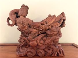 Ornately carved wood  Asian figure on elaborate stand
