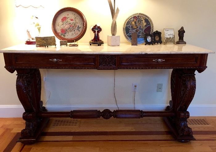 Heavily carved console table with marble top