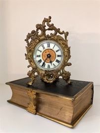 Another miniature antique clock, porcelain face.