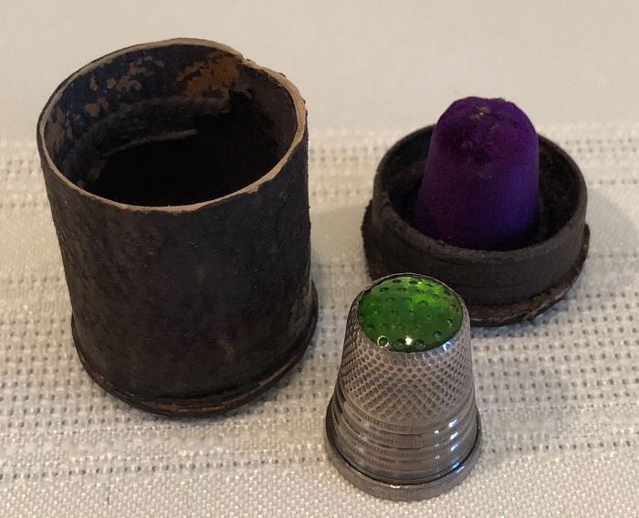 Antique thimble with leather case