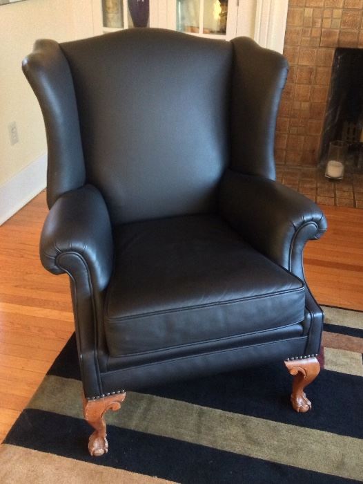 Vintage wingback chair, professionally recovered in black leather