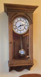 Howard Miller 30" tall oak wall clock with triple chime (Model 612-575)