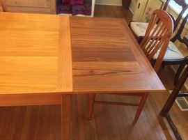 Table extends to 92" long with both leaves out. (Each leaf is 19.5 long)