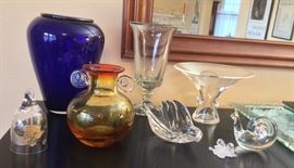 Art glass including Bjorn Winblad glass bell, signed cobalt blue vase, Steuben flared bowl by George Thompson, Steuben snail paperweight, small Swarovski oak leaf with snails