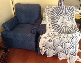 2 blue Drexel armchairs, round crocheted tablecloth