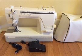 Husqvarna Viking Mega Quilter sewing machine. Includes vinyl cover, instruction DVD, leg control arm & low plastic table that fits around machine (not shown) Note: This machine is for use with quilting frame - see next photo