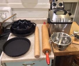 Cousances 10" cast iron tart pan, Lodge 12" cast iron skillet, bundt pan, rolling pins (bigger one is 28" long), food mill, Waring Pro deep fryer