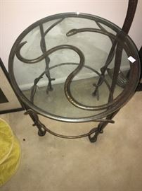 Interesting glass top serpent table