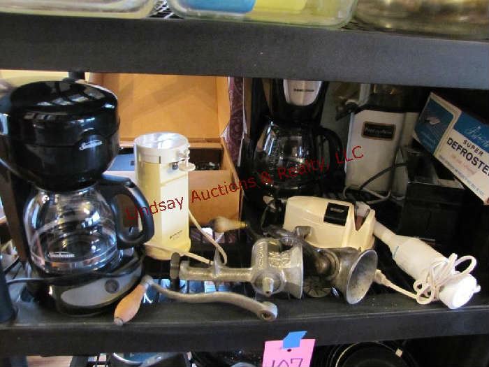 Group small appliances: 2 coffee pots, burger maker, can opener, knife sharpener & defroster