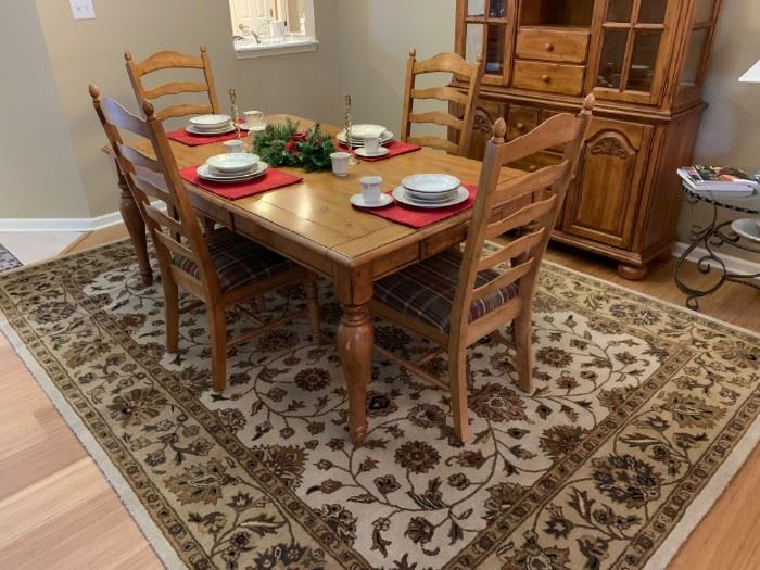 Dining room table with large area rug