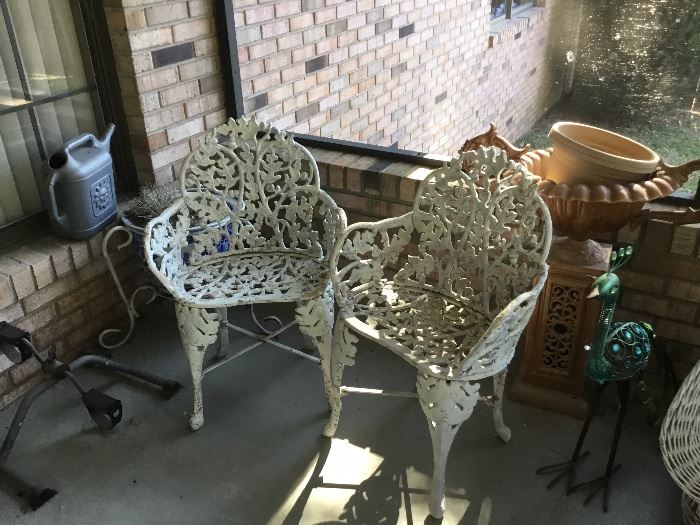Pair of cast irons chairs