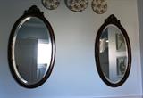 Oval beveled-glass mirrors