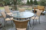 Fortunoff cast aluminum patio set - 60" round table, 6 side chairs and 2 lounges, market umbrella w/stone umbrella stand