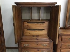 Chest open - drawers in bottom portion with shelves and cubbies at the top
