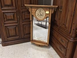 Wall Clock with decorative mirror and shelf.