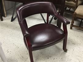 Burgundy chair that rolls