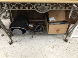 Items on Bakers rack bottom shelf