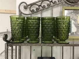 Set of 8 Green Fostoria tea glasses - top shelf of bakers rack