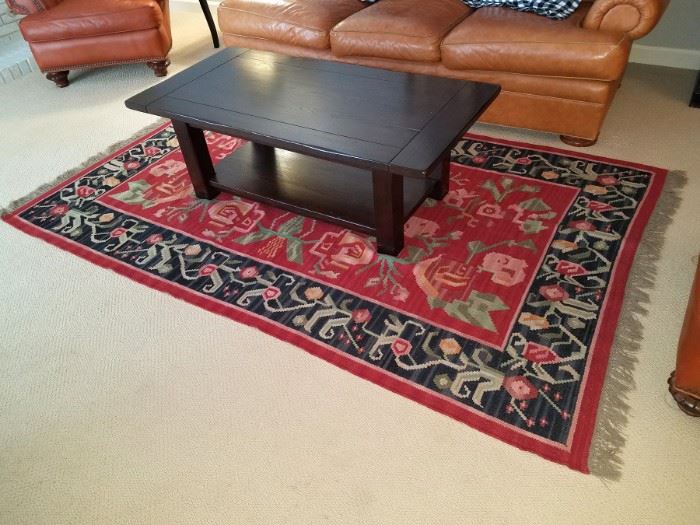 Hand-woven rug $300. Pottery Barn coffee table $75
