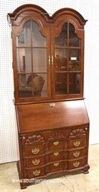 Mahogany Block Front Slant Front Desk with Bookcase Top by “Jasper Cabinet”
Located Inside – Auction Estimate $300-$600