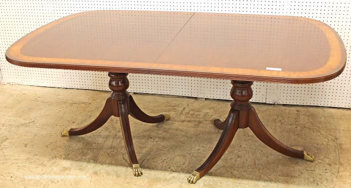 7 Piece Mahogany Banded and Inlaid Dining Room Table with 2 Leaves and 6 Carved Ball and Claw Dining Room Chairs in the Chippendale Style by “Ethan Allen Furniture”
Located Inside – Auction Estimate $800-$1500