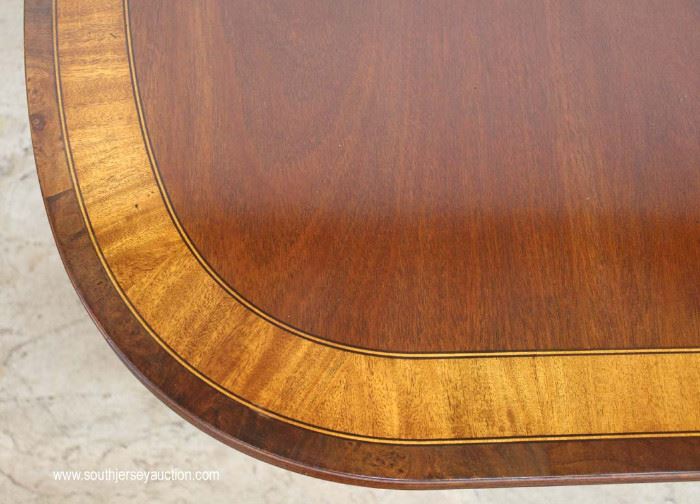 7 Piece Mahogany Banded and Inlaid Dining Room Table with 2 Leaves and 6 Carved Ball and Claw Dining Room Chairs in the Chippendale Style by “Ethan Allen Furniture”
Located Inside – Auction Estimate $800-$1500