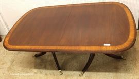 7 Piece Mahogany Banded and Inlaid Dining Room Table with 2 Leaves and 6 Carved Ball and Claw Dining Room Chairs in the Chippendale Style by “Ethan Allen Furniture”
Located Inside – Auction Estimate $800-$1500