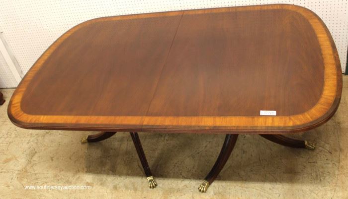 7 Piece Mahogany Banded and Inlaid Dining Room Table with 2 Leaves and 6 Carved Ball and Claw Dining Room Chairs in the Chippendale Style by “Ethan Allen Furniture”
Located Inside – Auction Estimate $800-$1500