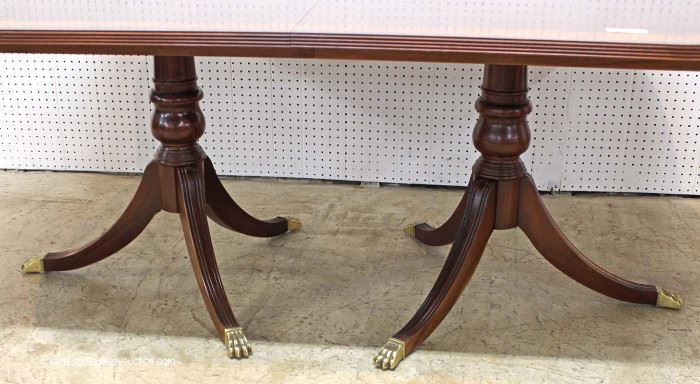 7 Piece Mahogany Banded and Inlaid Dining Room Table with 2 Leaves and 6 Carved Ball and Claw Dining Room Chairs in the Chippendale Style by “Ethan Allen Furniture”
Located Inside – Auction Estimate $800-$1500