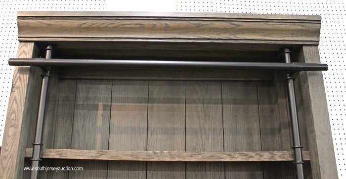 Contemporary Gray Distressed Library Style Open Face Bookcase with original tags by “Martin Furniture”
Located Inside – Auction Estimate $300-$600