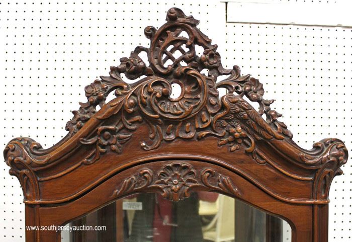 Early 20th Century Highly Carved Mirrored Back French Style Display Cabinet – Nice Size
Located Inside – Auction Estimate $300-$600