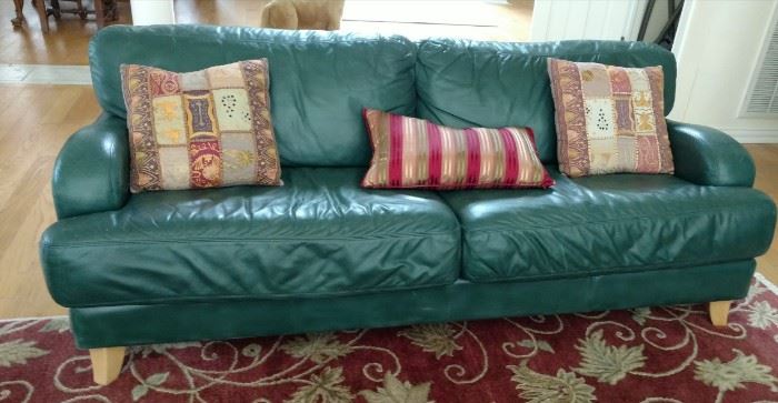 Green leather sofas (2 of them) Purchased from Tal-Y-Bont Interiors in Morehead City. 