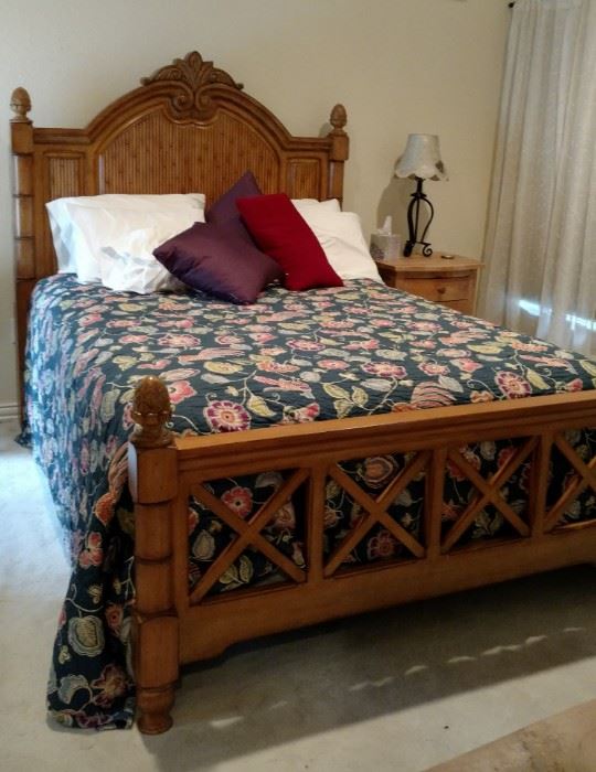 Queen master bed, Tommy Bahama. Linens sold separately. Nightstands are from Restoration Hardware