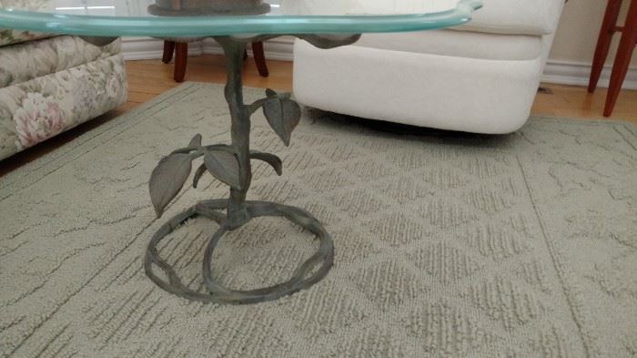 Round glass top table with leaf motif for base 