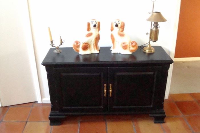 Kincaid ebony server, two antique Staffordshire dogs. early brass Kosmos Brenner converted student lamp.