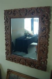 Hand carved wall mirror.