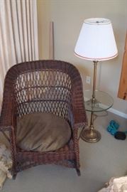Wicker chair and floor lamp.