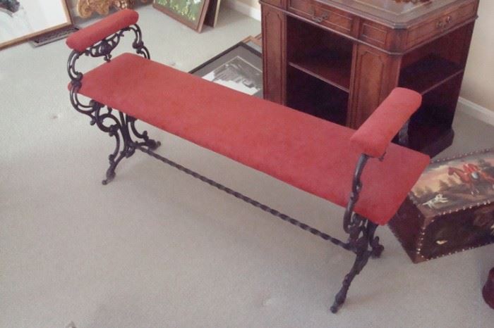 Cast iron upholstered bench.