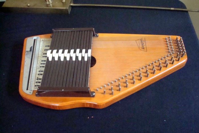 Auto harp and case by Oscar Schmidt.
