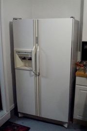 Amana refrigerator/freezer with ice maker.