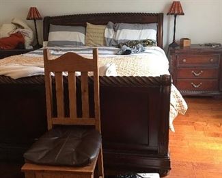 King size sleigh bed with coordinating nightstands and large wardrobe closet