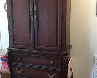 King size sleigh bed with coordinating nightstands and large wardrobe closet