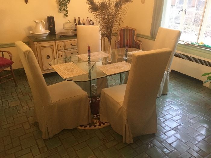Very Nice Glass Dining Table and  Chairs...this is available pre sale so call for details.