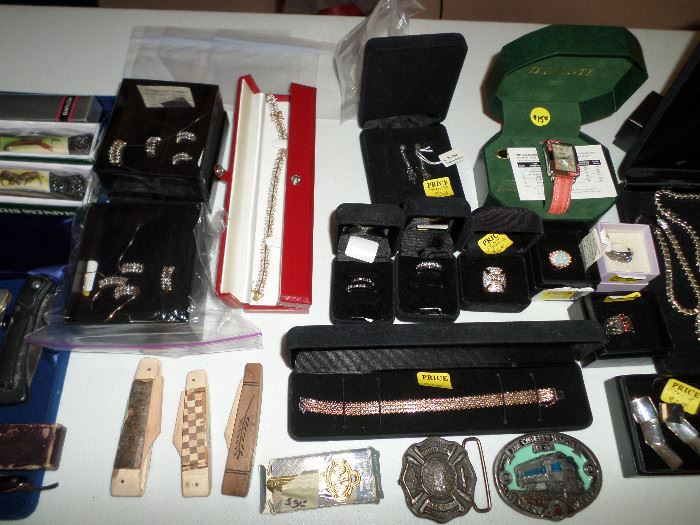 some pocket knives, belt buckles & small bit of the sterling jewelry