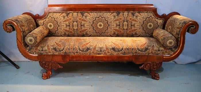 024a  Mahogany Empire sofa with heavily carved legs, scroll arms and green upholstery, 35 in. T, 7 ft. 3 in. T, 20 in. D.