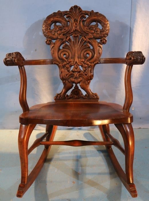 123a  Mahogany heavily carved rocker attrib. to Horner, 33 in. T, 25 in. W, 17 in. D.