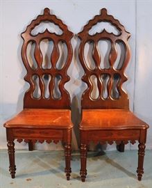 145a Two solid walnut Victorian hall chairs, 50.5 in. T, 19 in. W, 15 in. D.