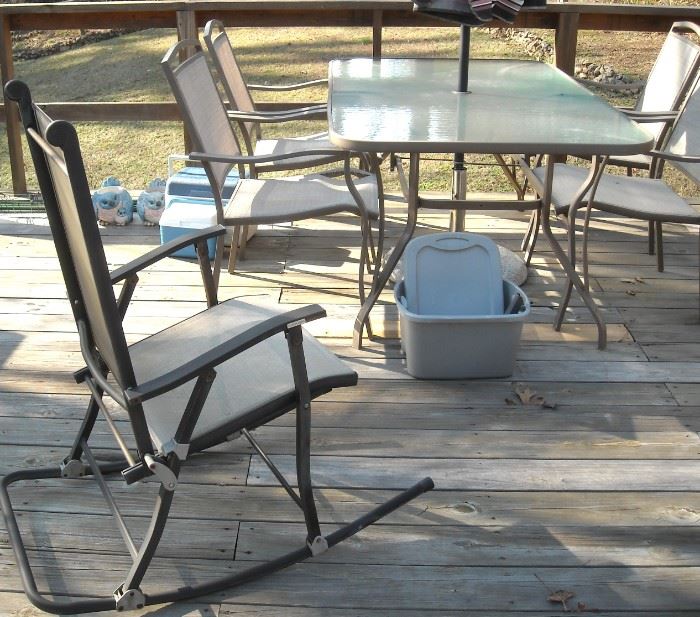 Nice patio table, chairs, umbrella and rocker